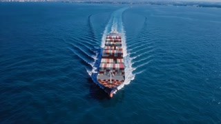 A Large Container Ship Skillfully Navigating Calm Waters, Highlighting The Essence Of Maritime Transport