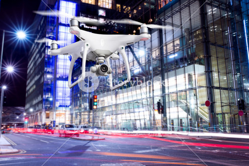 Close Up Of Hovering Drone Taking Pictures Of City Of London At Night