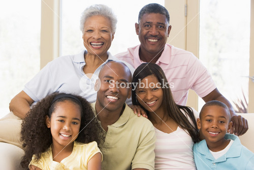 Extended Family Sitting On Sofa
