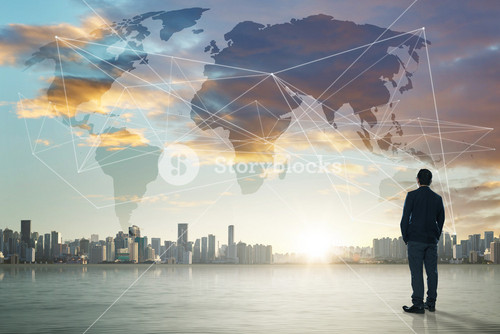 International Business Concept With Businessman On City Skyline Background With Network On Map And Sunlight