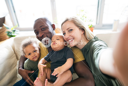 Loving Family At Home Capturing A Precious Moment Together