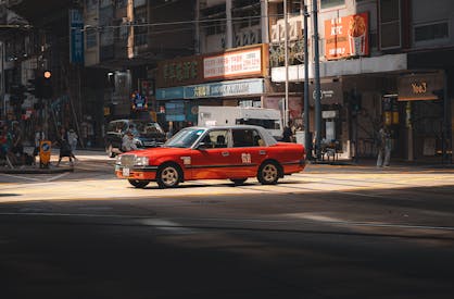 Red Taxi On Hong Kong Street At Daytime