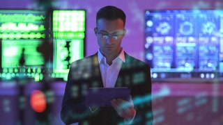The Male With A Tablet Standing On Displays Background