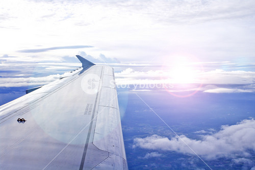 View Of Jet Plane Wing With Cloud Patterns